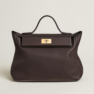 Shop HERMES 24/24 - 21 Verso Bag (H082817CKAM) by Camellianectar