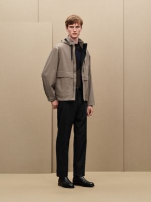 Jacket with foldable hood