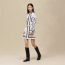 "Ex-Libris a Main Levee" buttoned miniskirt, blanc nacre