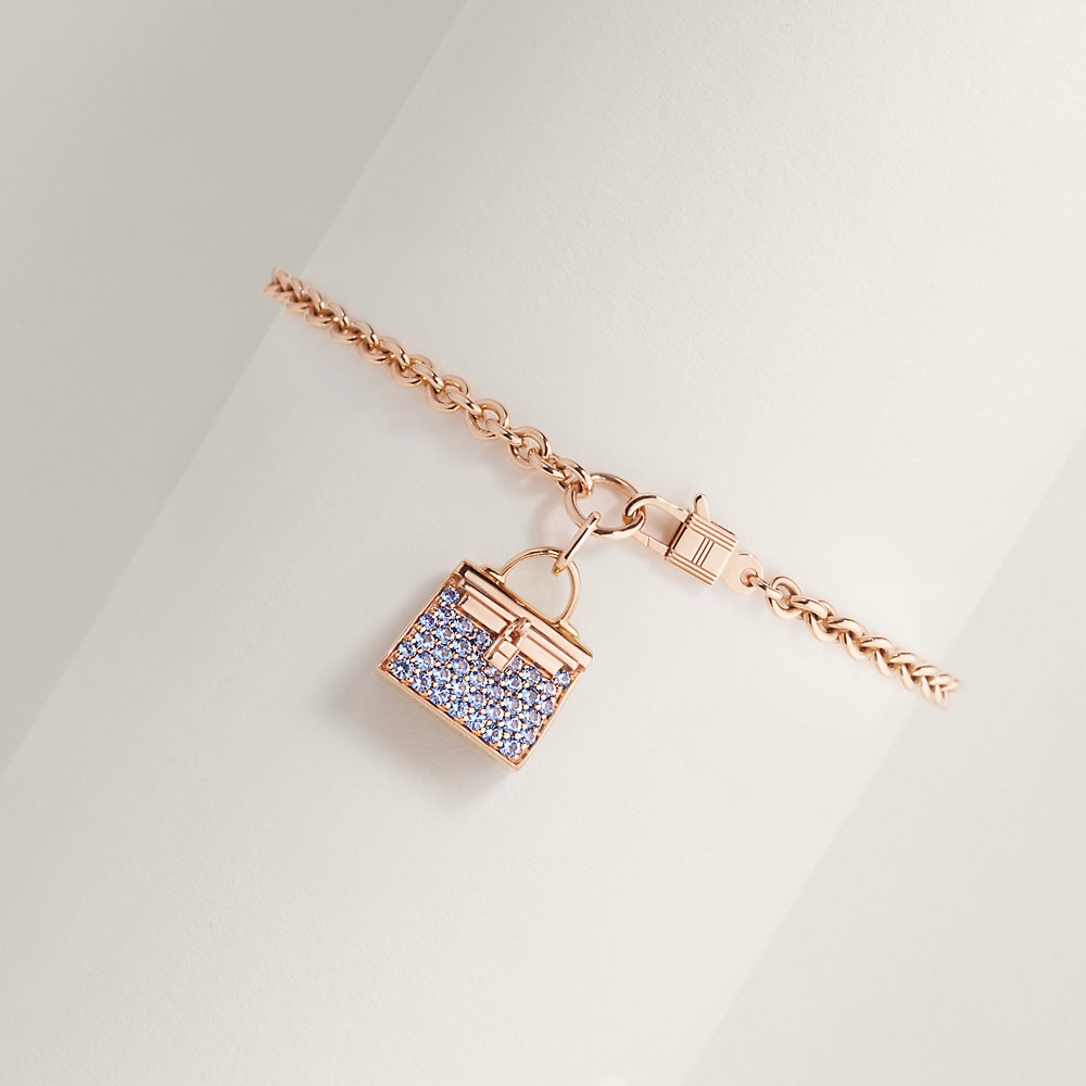 Hermes silver charm bracelet with charms that are from their iconic  collections