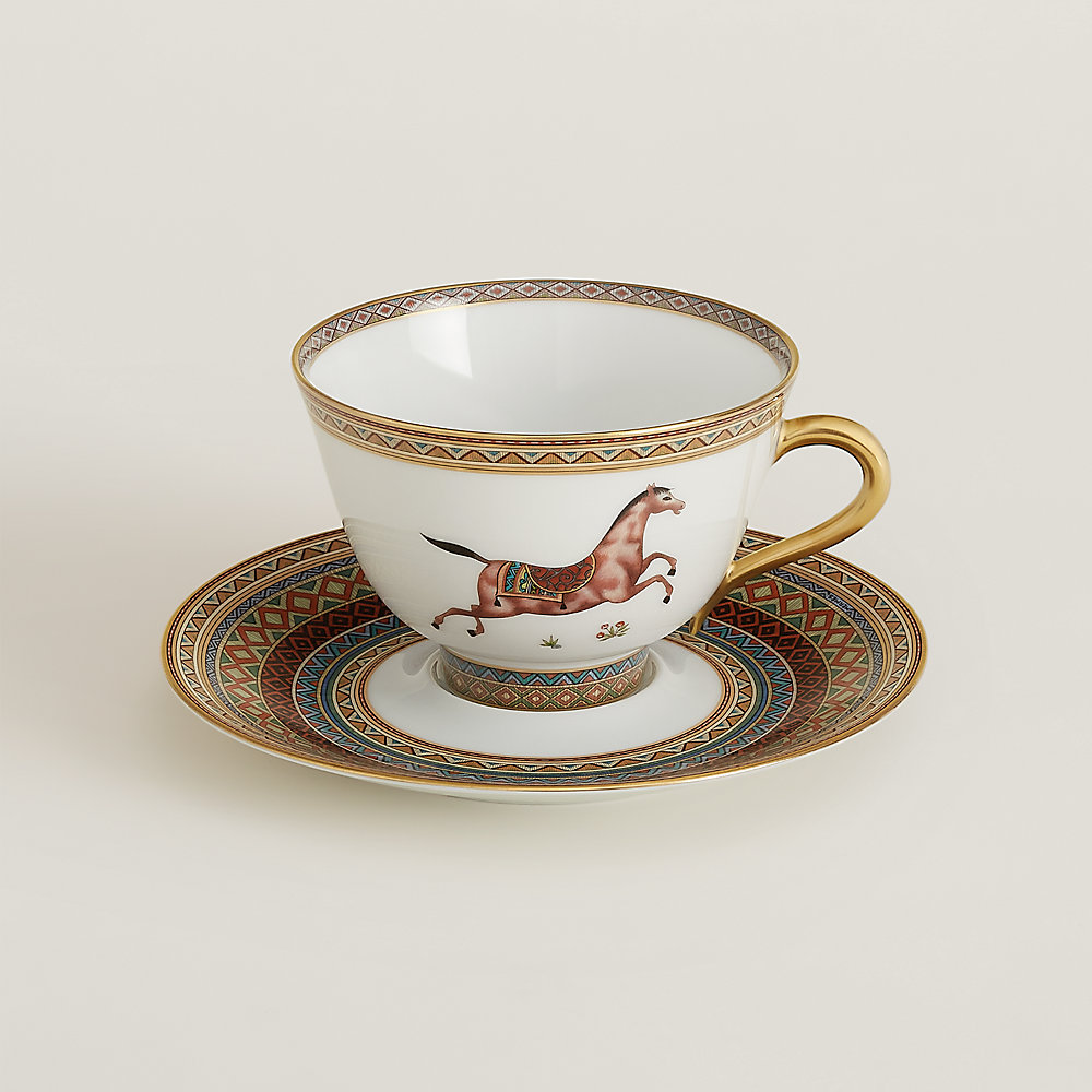 https://assets.hermes.com/is/image/hermesproduct/cheval-d-orient-tea-cup-and-saucer-n-3--009883P-worn-1-0-0-1000-1000_g.jpg