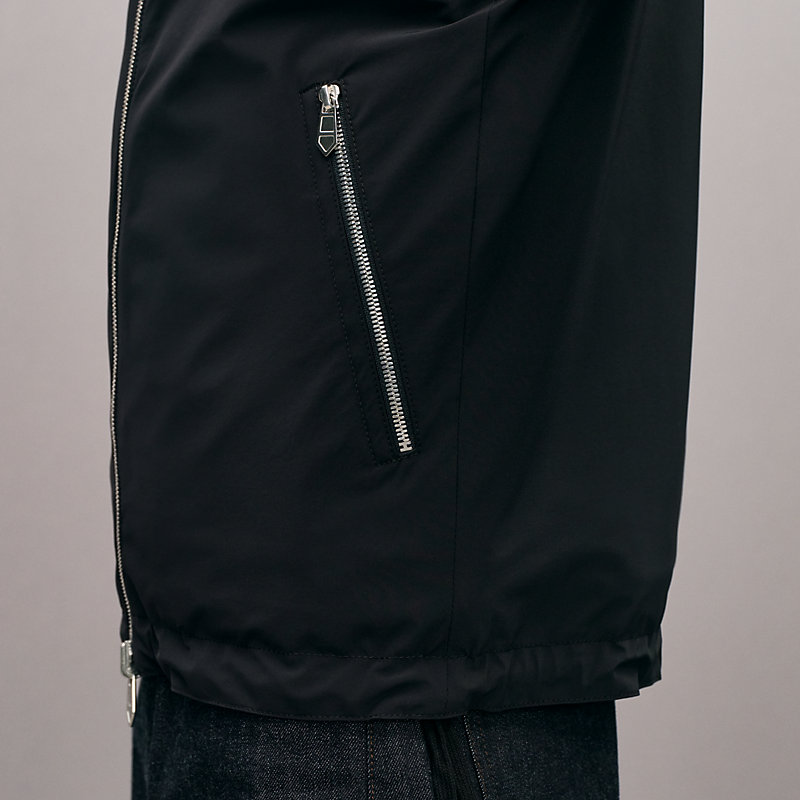 Gilet sans manches à capuche réversible