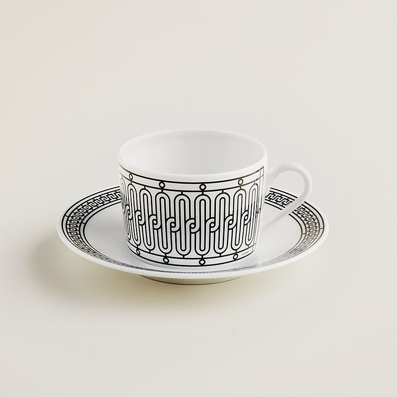 https://assets.hermes.com/is/image/hermesproduct/h-deco-tea-cup-and-saucer--037016P-worn-1-0-0-800-800_g.jpg