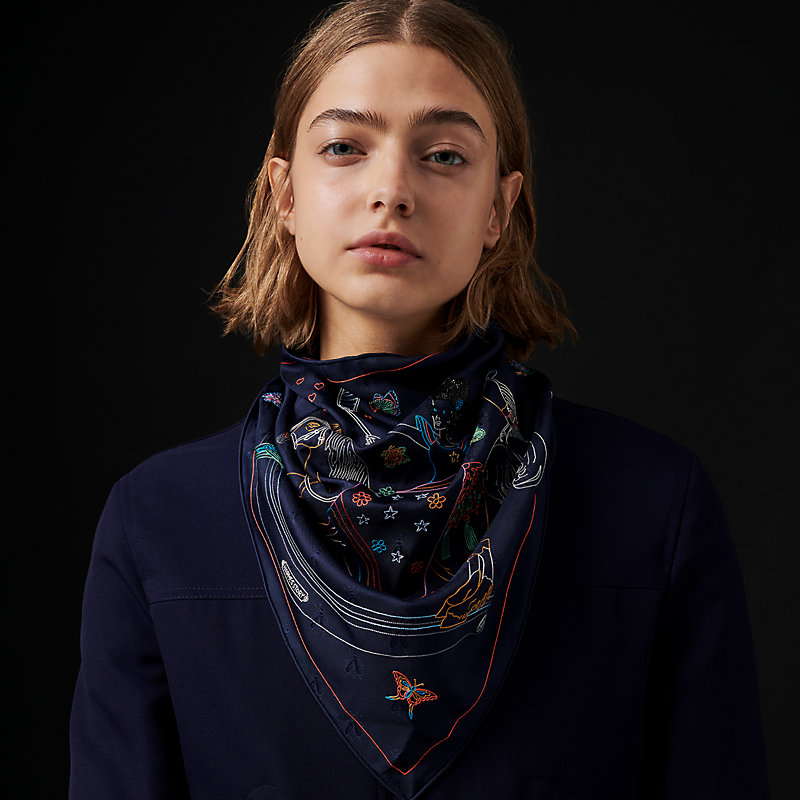 https://assets.hermes.com/is/image/hermesproduct/hermes-story-embroidered-triangle-scarf--883875S%2002-worn-1-0-0-800-800_g.jpg