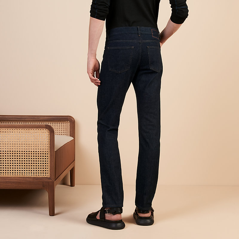 Jeans lavato con etichetta in pelle