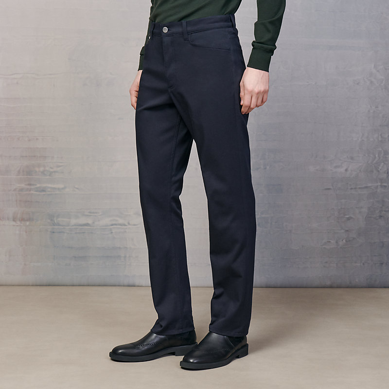 Jeans with leather pocket detail 