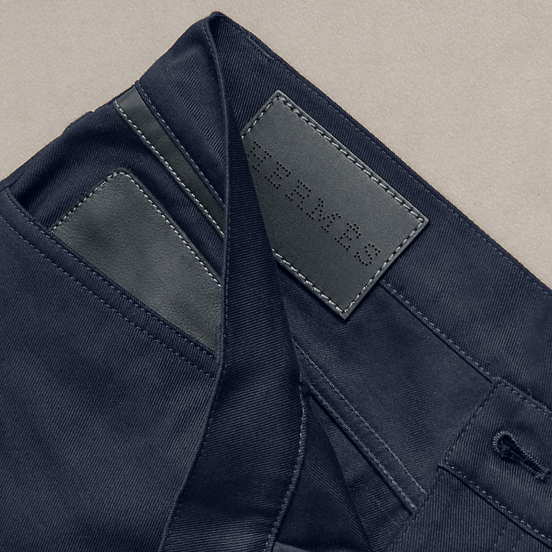Jeans with leather pocket detail 