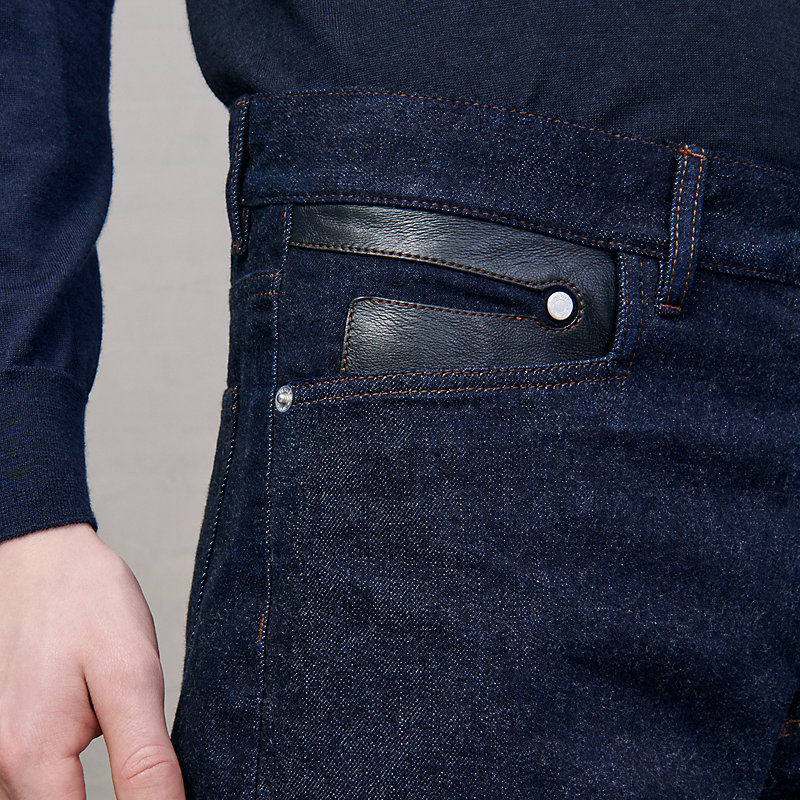Jeans with leather pocket detail