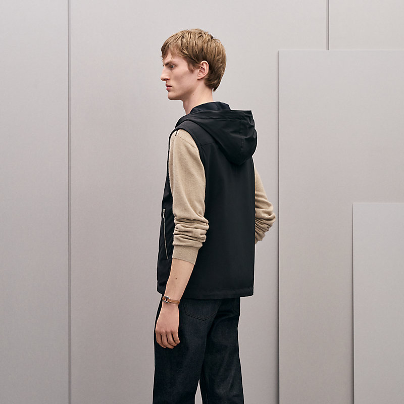 Reversible hooded vest