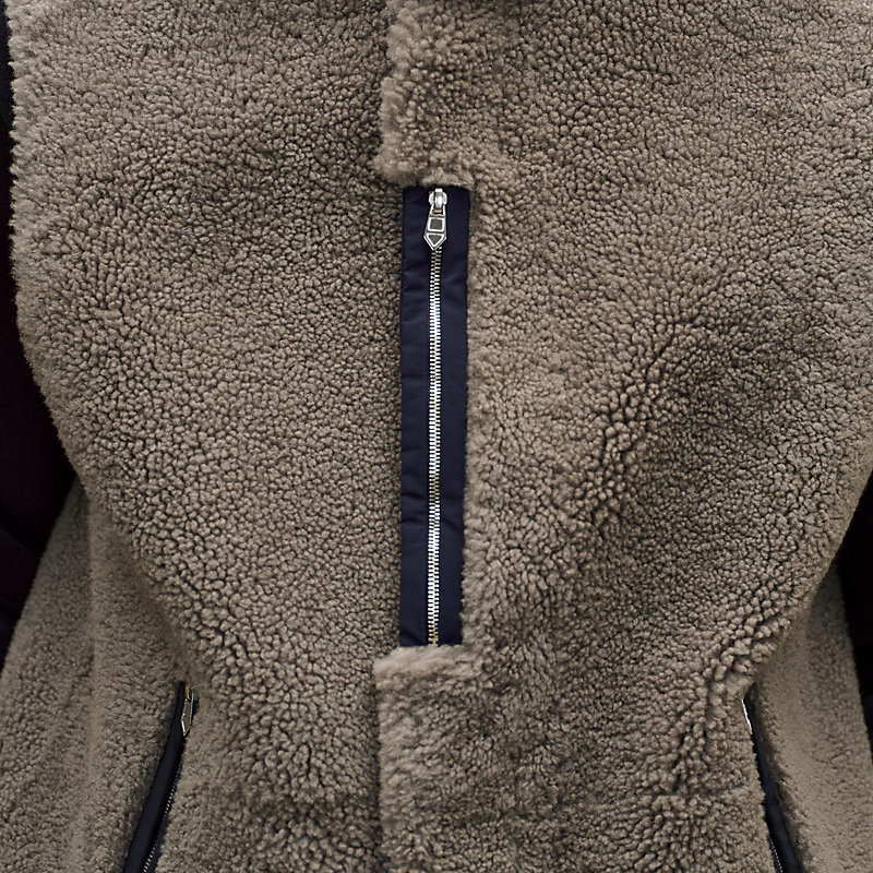Reversible hooded vest