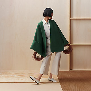 Single-sleeved reversible cape