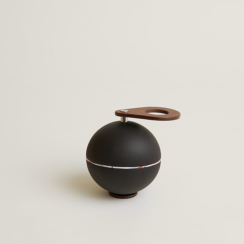 Spherical music box with a came key