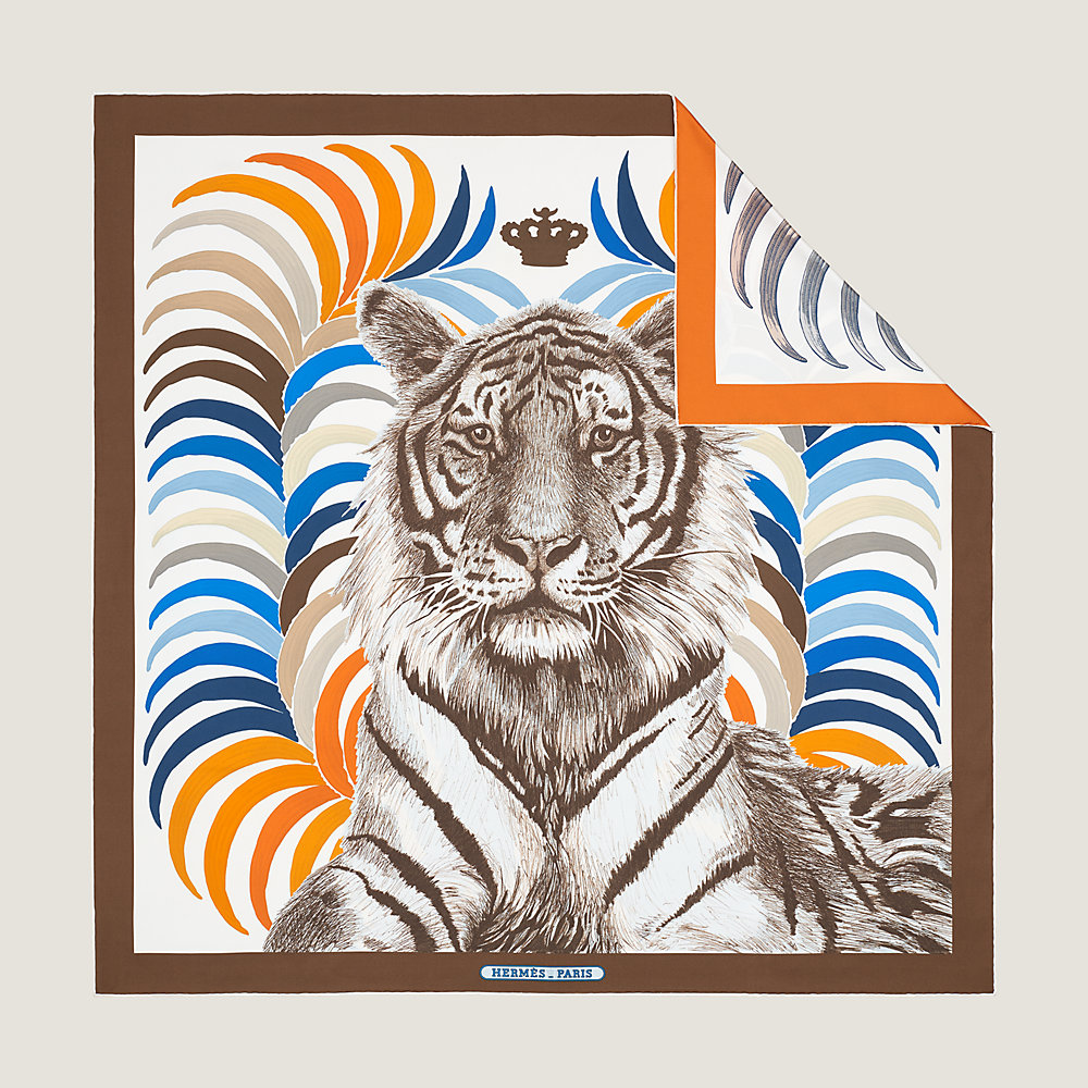 Hermes Scarf Guides - Tigre Royal Double Face 2022 Christiane Vauzelles  H903887S. In 1977, Christiane Vauzelles chose to showcase this majestic  feline surrounded by two golden palms. The noble creature takes center