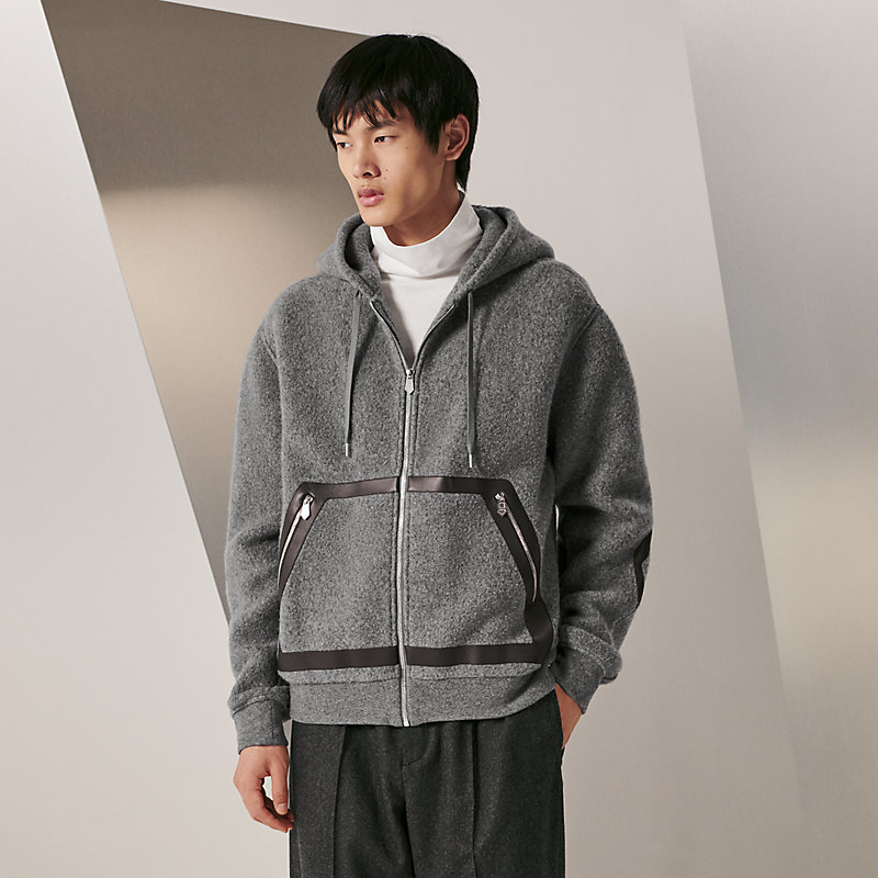 Long sweater with outlet hood and pockets